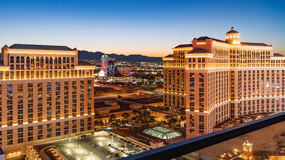Stunning aerial view of the illuminated Bellagio Hotel and Las Vegas skyline during twilight.