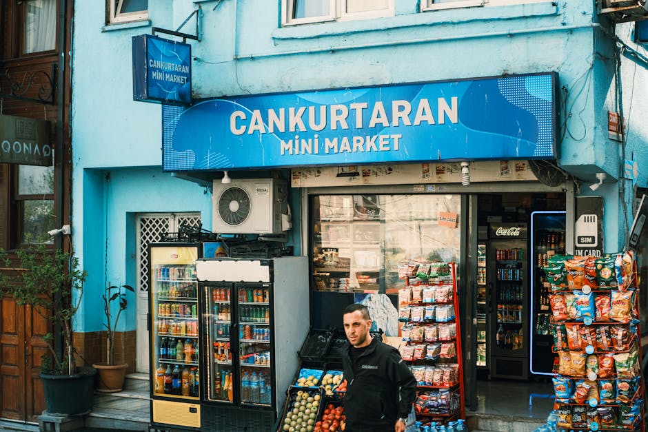 View of Cankurtaran Mini Market with vivid facade and various snacks and drinks on display.