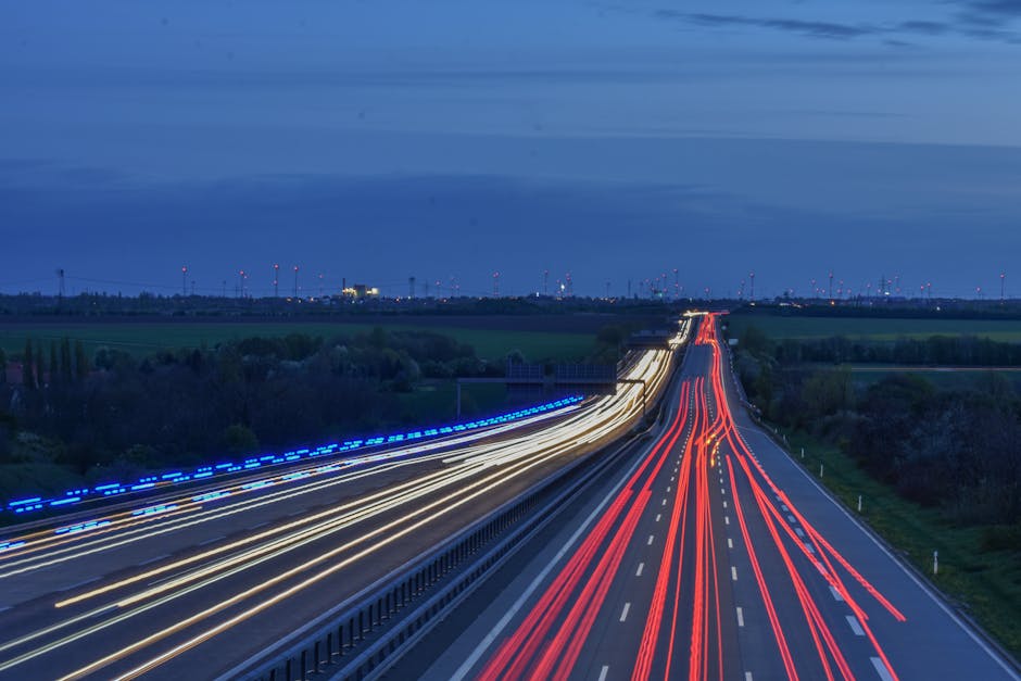 A stunning long exposure photo capturing light trails on a German highway during twilight.