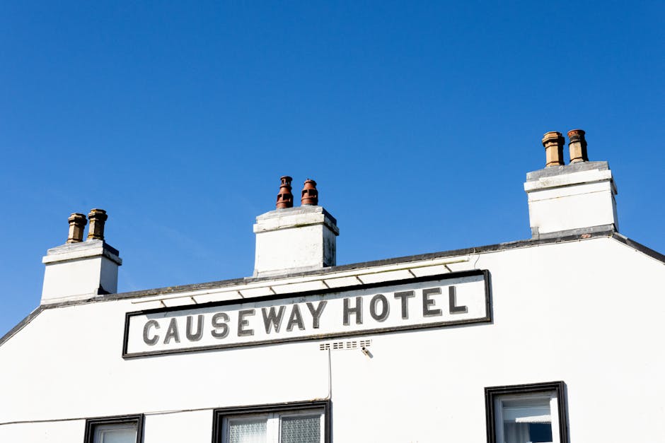 A vibrant capture of Causeway Hotel in Northern Ireland, featuring a clear blue sky.