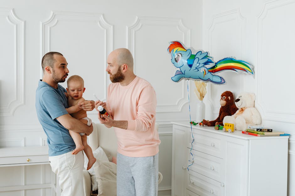 A same-sex couple taking care of their baby in a beautifully decorated room, surrounded by toys.